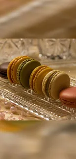 Colorful macarons elegantly arranged on a glass tray.