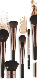 Elegant rose gold and brown makeup brushes with powder accents.