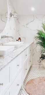 Elegant marble bathroom with plants and white cabinets.