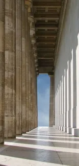 Elegant marble columns with sky view in a classic architectural setting.