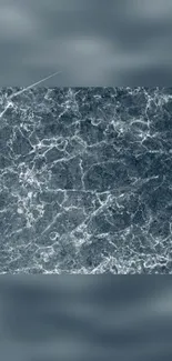 Gray marble texture wallpaper with white veins.