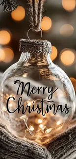 Merry Christmas ornament with lights and bokeh background.