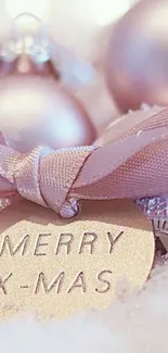 Elegant wallpaper with Merry Christmas tag and pastel ornaments.