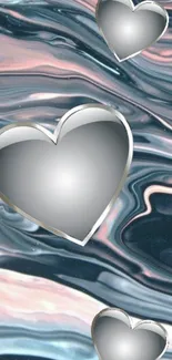 Metallic hearts on abstract, flowing pastel blue background.