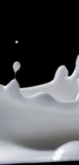 Elegant milk splash wallpaper with dynamic white curves on black background.