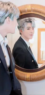 Person in suit looking at mirror reflection.