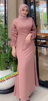 Elegant woman in dusty rose hijab and dress.