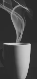 Elegant monochrome steaming coffee mug photo in black and white.