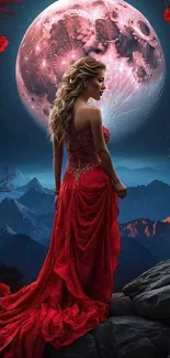 Woman in red dress under a moonlit sky with mountain backdrop.