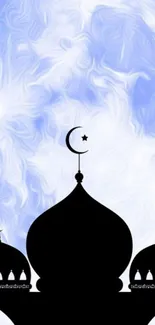 Silhouette of a mosque with a full moon background.