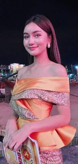 Woman in elegant dress at night event.