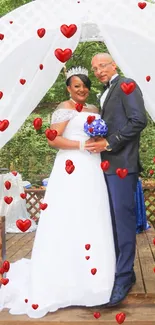 Elegant outdoor wedding with a couple under a decorative arch.