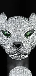 Diamond-encrusted panther with emerald eyes on black background.