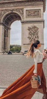 Woman in flowing skirt near Arc de Triomphe in Paris.