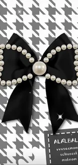 Elegant black bow with pearls on houndstooth background wallpaper.