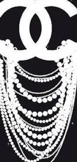 Elegant pearls on a chic black background, perfect for a sophisticated wallpaper.