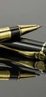 Luxurious black and gold pen on a dark reflective surface.