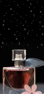 Elegant perfume bottle with stars on black background wallpaper.