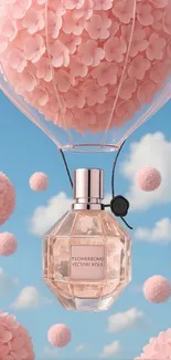 Perfume bottle balloon with pink flowers against blue sky.