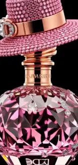 Luxurious pink crystal perfume bottle topped with a sparkling hat.