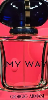 Elegant perfume bottle against vibrant pink background.