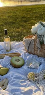 Serene lakeside picnic at sunset with flowers and wine.