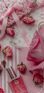 Pink aesthetic wallpaper with roses and perfume.