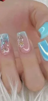 Elegant pink and blue nails with glitter design.