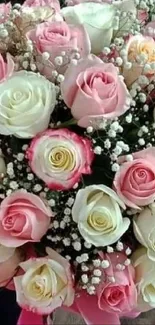 Bouquet of pink and white roses with greenery.