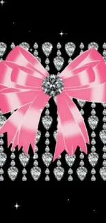 Elegant pink bow with diamonds on a black background.