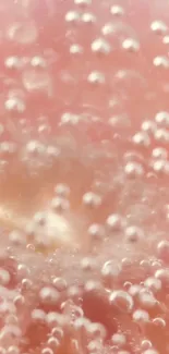 Close-up of pink bubbles creating a soft, abstract texture.