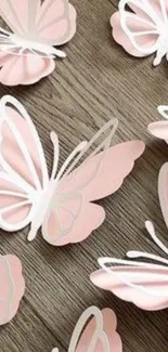 Pink butterflies on rustic wood wallpaper.