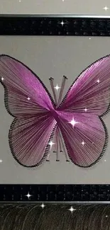 Elegant pink string art butterfly on framed design.