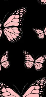 Pink butterfly pattern on black wallpaper background.