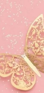 Pink wallpaper with golden butterfly and sparkles.