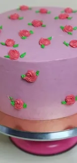 Pink cake with rose decorations, elegant and artistic.