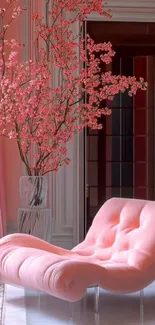 Pink chair with cherry blossoms in a stylish room.