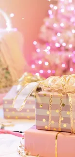 Pink Christmas gifts with twinkling lights on a bed.