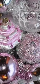 Elegant pink Christmas ornaments in silver accents for festive decor.