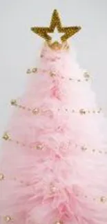 Charming pink Christmas tree with gold accents and a star.