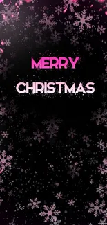 Pink Christmas wallpaper with snowflakes and festive decorations on black background.