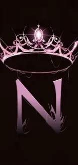 Pink crown and letter N on dark background.