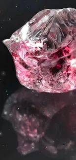 Pink crystal on black background, artistic wallpaper.