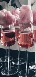 Pink cotton candy on wine glasses wallpaper.