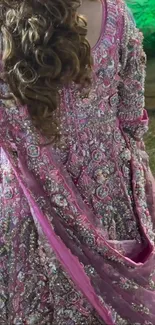 Back view of pink embroidered dress with intricate design displayed.