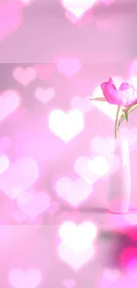 Beautiful pink flower in vase with heart bokeh effect.