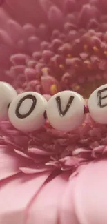 Pink flower with 'Love' beads in elegant design.