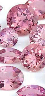 Elegant pink gemstones shining in various shapes on a clean white background.