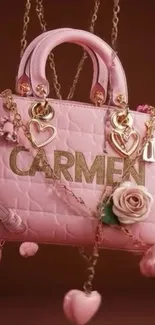 Elegant pink handbag with heart and floral details.