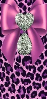 Pink leopard print wallpaper with silk bow and diamond hearts.